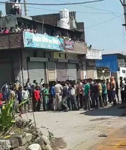 migrant laborers pelted stones at police